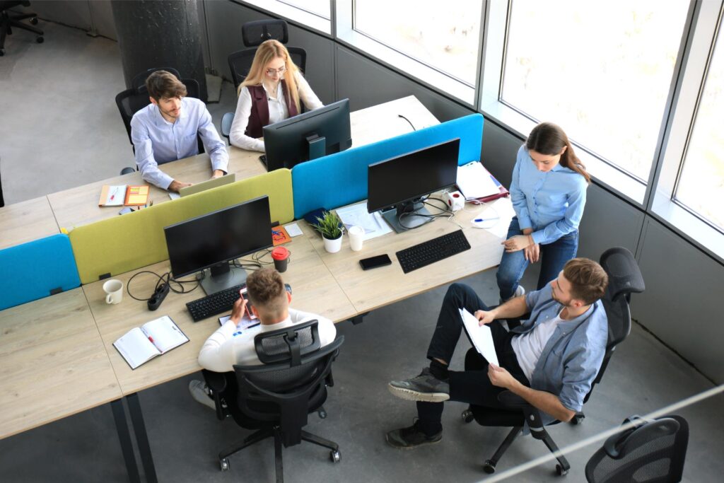 A project team working together at desks in an open office