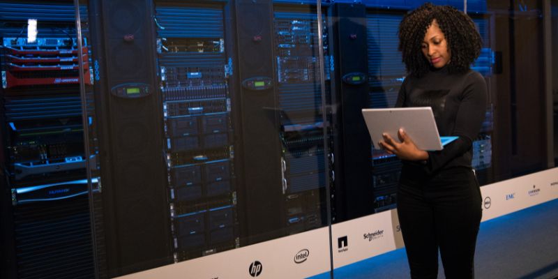 IT engineer performing legacy hardware support in a data center server room